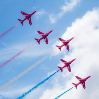 Five Red Arrows planes flying in formation